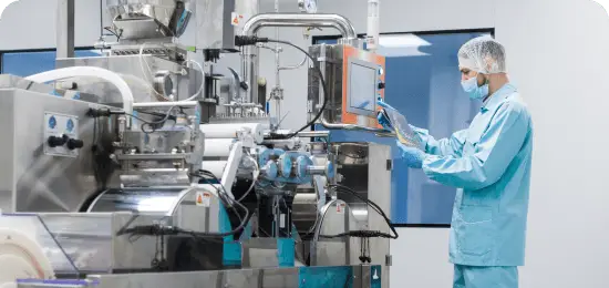 Worker in clean facility touching a screen for food instrument.